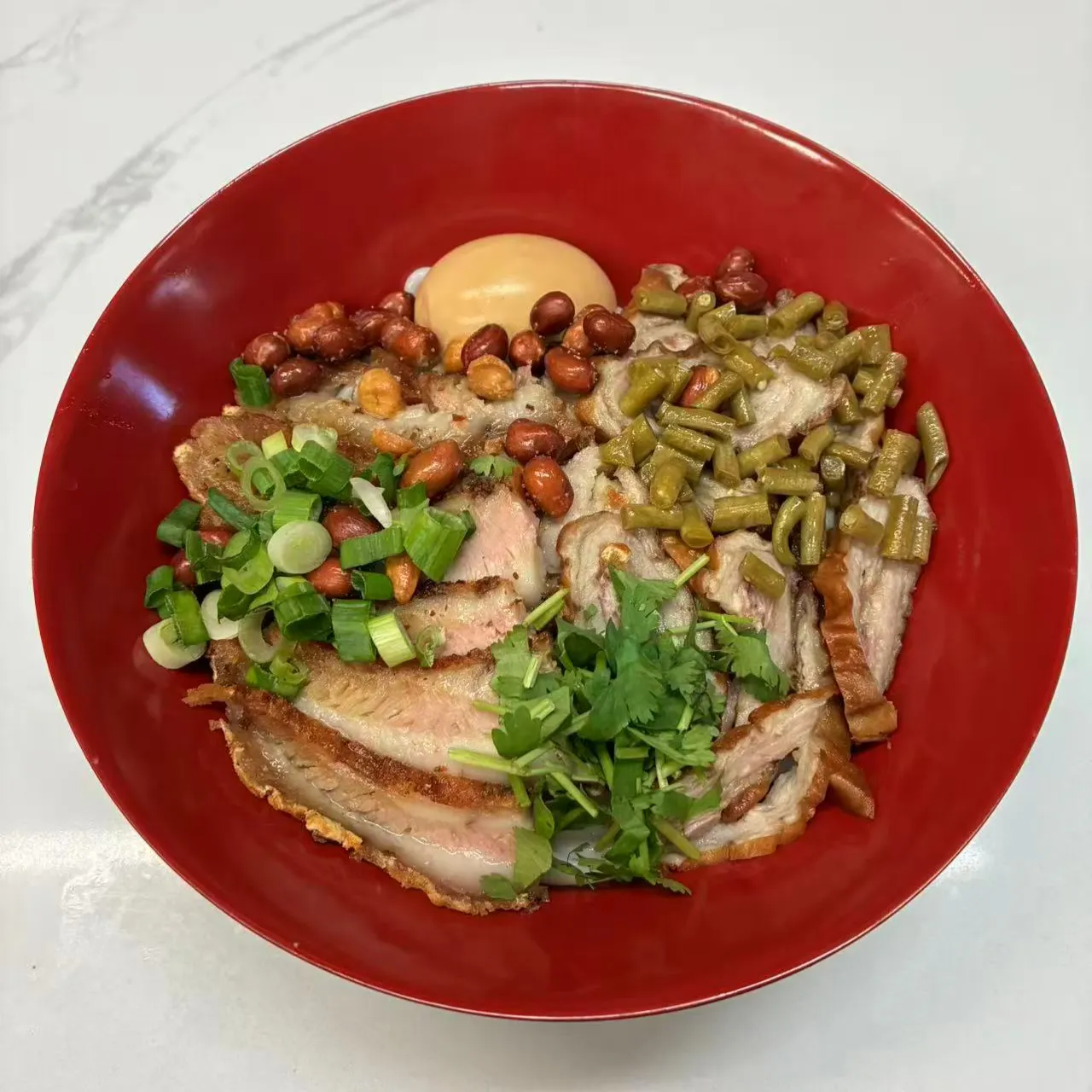 Dry rice noodles loaded with crispy roasted pork and toppings at Impression Guilin Noodle, a Chinese Noodle Restaurant in Monterey Park