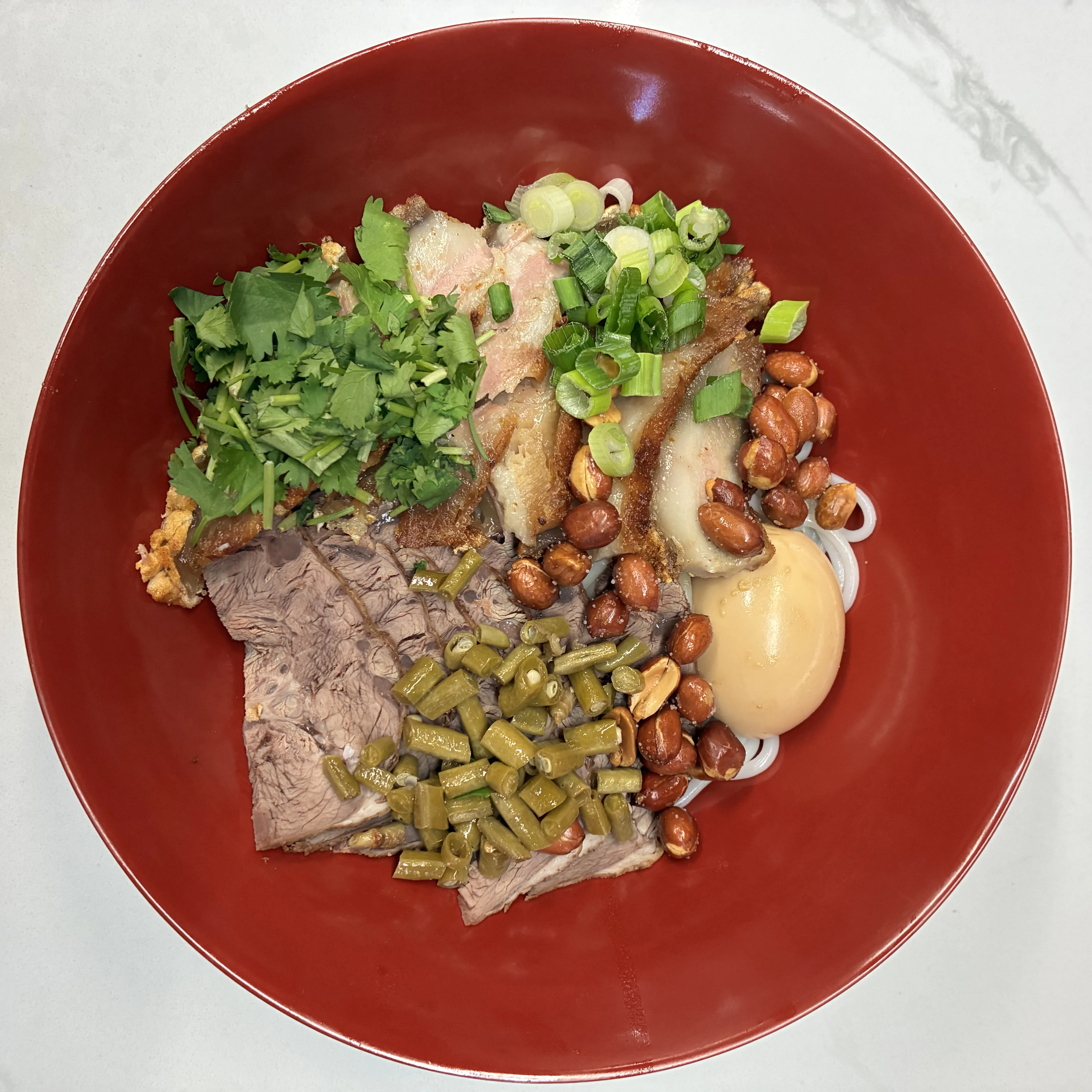 Dry rice noodles with beef, crispy pork, peanuts and sour beans at Impression Guilin Noodle, a Chinese Noodle Restaurant in Monterey Park